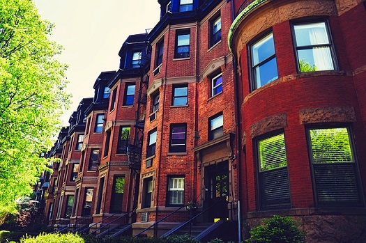picture of a brooklyn street with a bunch of brownstones