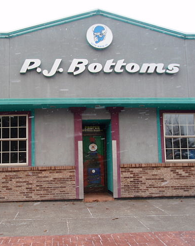 Picture of the front of PJ Bottoms, a dive bar on Main Street in Buffalo, New York.