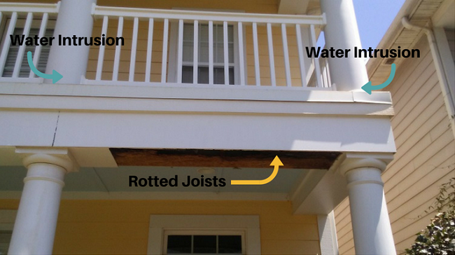 a picture of my neighbor's two story porch showing the columns where water intruded