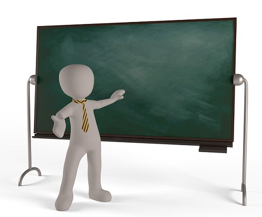 A picture of a balloon person standing in front of a chalkboard teaching a lesson