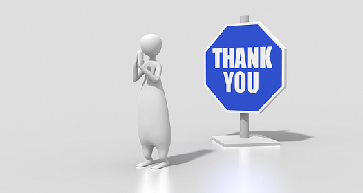 a picture of a bubble person standing in front of an octagonal sign which reads "thank you"